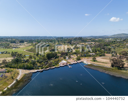 Aerial view over water reservoir and a large dam that holds water. Rancho Santa Fe in San Diego Aerial view over water reservoir and a large dam that holds water. Rancho Santa Fe in San Diego 104440732