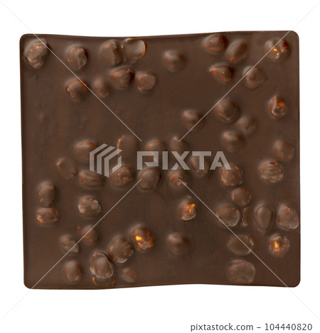 Whole bar of dark chocolate with flattering nuts isolated on white background. A square bar of chocolate divided into small rectangles. Bottom view, close-up. 104440820