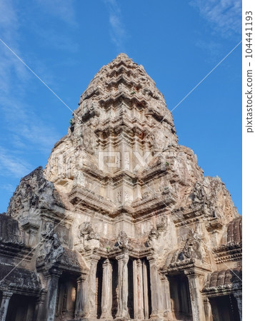 Angkor Wat's ornate stone tower on sunny day. Angkor Wat's ornate stone tower on sunny day. 104441193