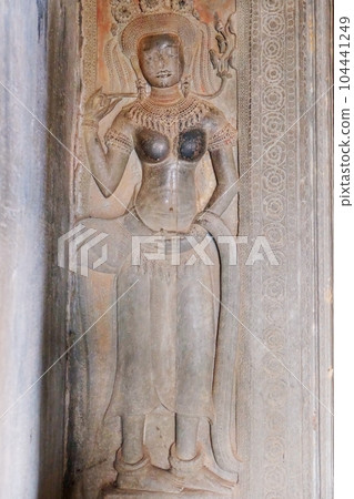An ancient bas-relief image of a woman in a medieval Khmer temple. An ancient bas-relief image of a woman in a medieval Khmer temple. 104441249
