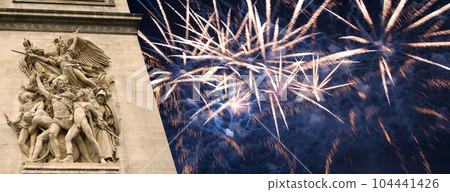 Celebratory colorful fireworks over the Arc de Triomphe, Paris, France. The walls of the arch are engraved with the names of 128 battles and names of 660 French military leaders (in French) 104441426