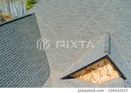 Quality roof work performed after installation of asphalt shingles new house is inspected on regular basis 104442637