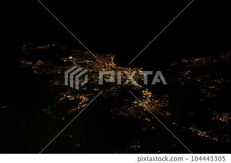 Nighttime aerial view of illuminated city Saint Raphael and coastal France from the sky 104443305