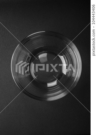 Transparent glass bowl as an element of kitchen utensils for cooking at home Transparent glass bowl as an element of kitchen utensils for cooking at home 104443406
