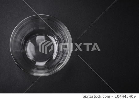 Transparent glass bowl as an element of kitchen utensils for cooking at home 104443409