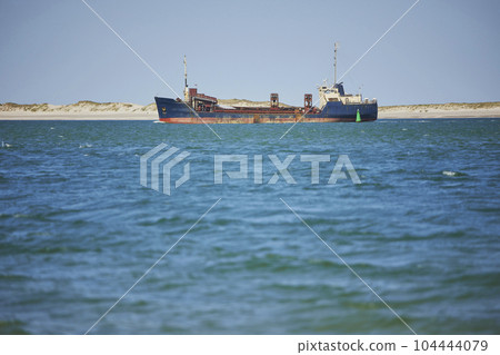 Old ship sails in the north sea in Denmark 104444079