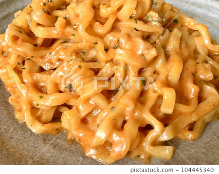 Korean spicy stir-fried noodles close-up 104445340