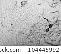 Cracks and fissures in the grunge texture material (white) paint 104445992