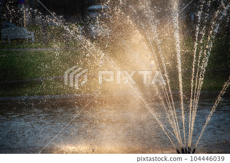 A fountain in a public park 104446039