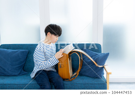 Elementary school boy living room 104447453