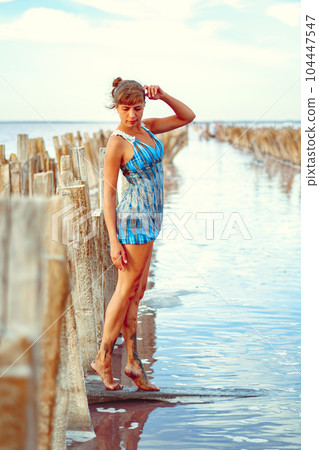 a girl in a swimsuit on a salt lake a girl in a swimsuit on a salt lake 104447547