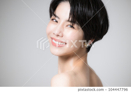 A Japanese woman with a beautiful shoulder looking back looking at the camera A Japanese woman with a beautiful shoulder looking back looking at the camera 104447796
