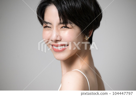 A Japanese woman with a beautiful shoulder looking back looking at the camera 104447797