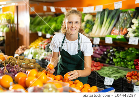 Girl at her first job in vegetable shop Girl at her first job in vegetable shop 104448287