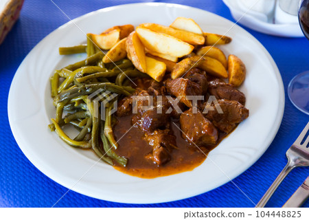 Veal stew with vegetables 104448825