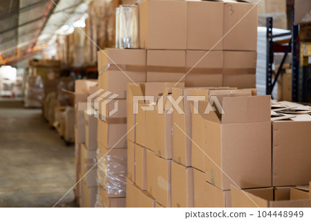 Lots of cardboard boxes in fulfillment center 104448949