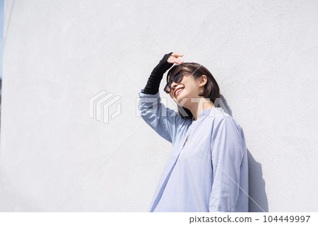 Portrait of a woman doing sun protection 104449997