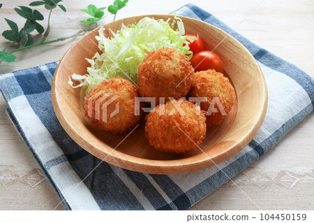 Freshly fried bite size croquette 104450159