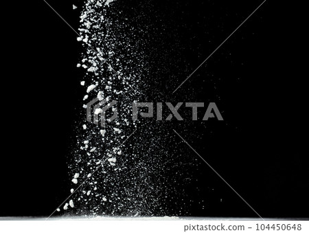 Tapioca starch flour fly explosion, White powder tapioca starch fall down in air. Seasoning flour powder is element material. Eyeshadow crush make up. Black background Isolated selective focus blur 104450648