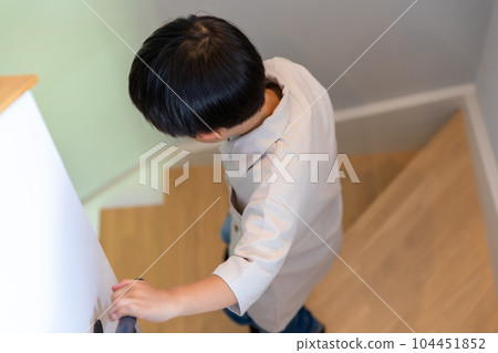 boy going down the stairs 104451852