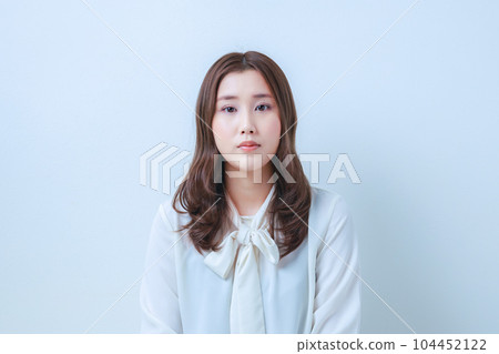 young woman in white blouse young woman in white blouse 104452122