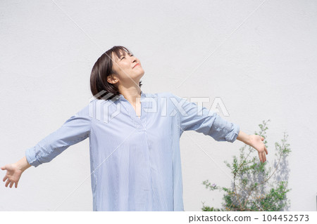 Portrait of a woman taking a deep breath 104452573