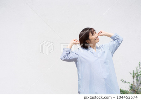 Portrait of a woman taking a deep breath 104452574