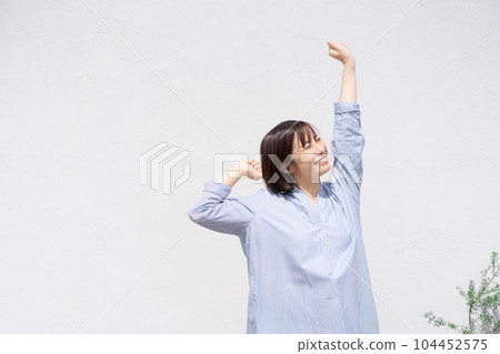 Portrait of a woman taking a deep breath 104452575