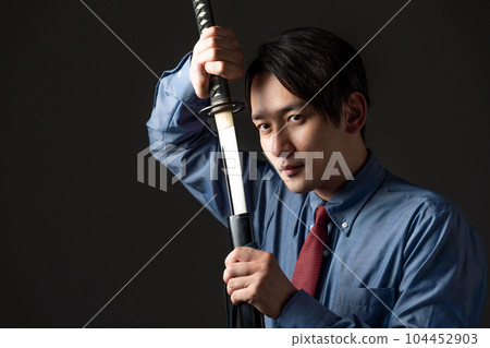 Businessman and Japanese sword Businessman and Japanese sword 104452903
