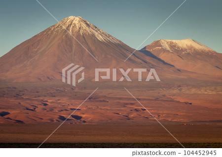 Licancabur and dramatic volcanic landscape at Sunset, Atacama Desert, Chile 104452945