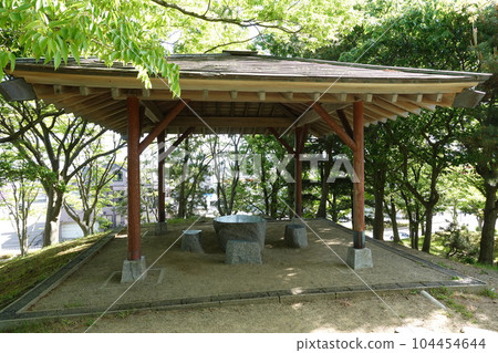 Arbor (rest area) in a park full of nature 104454644