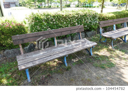 Bench in the shade of the park Bench in the shade of the park 104454782