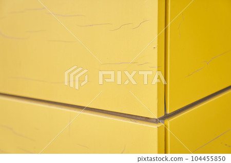 The exterior wall of the modern building is covered with yellow film. The futuristic building is designed using frame panels. With space to copy. High quality photo The exterior wall of the modern building is covered with yellow film. The futuristic building is designed using frame panels. With space to copy. High quality photo 104455850