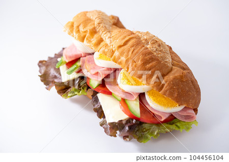 Egg, cheese, ham, baguette sandwich with plenty of vegetables 104456104