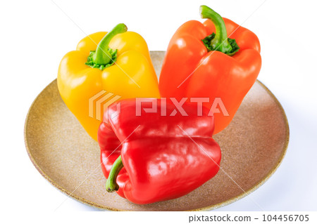 Three colored paprika on a plate 104456705