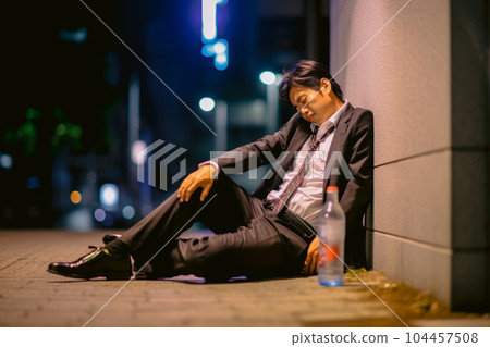 Japanese businessman drunk and sleeping on the... - Stock Illustration