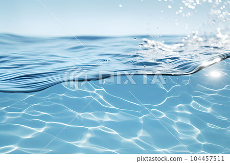 A cross section of a transparent water surface and splashing water droplets A cross section of a transparent water surface and splashing water droplets 104457511
