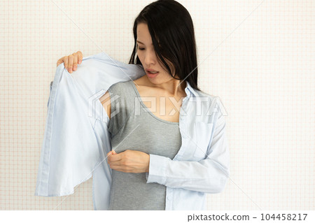 Sweating side by side Sweating side by side 104458217