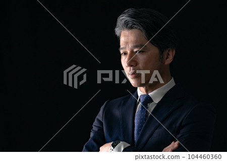 A man with his arms folded Business 104460360