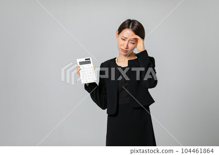A woman with a calculator Trouble A woman with a calculator Trouble 104461864