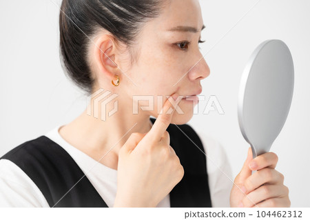 Women suffering from skin trouble Women suffering from skin trouble 104462312