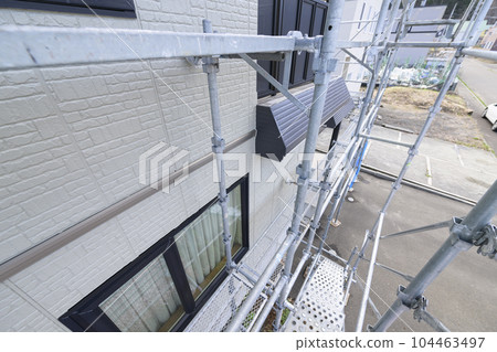 Home Remodeling House under exterior wall painting Home Remodeling House under exterior wall painting 104463497