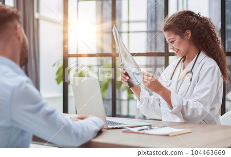 Doctor consulting patient hands closeup. Patient sitting at doctor office. Diagnostic healthcare, medical service, consultation or education, healthy lifestyle concept 104463669