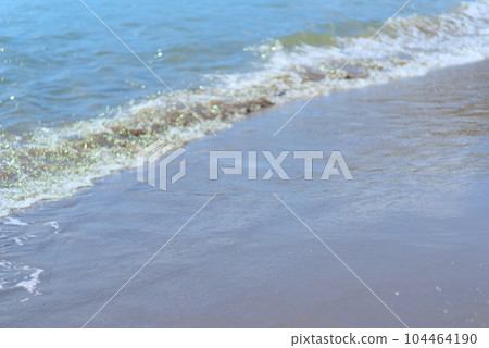 A wave that strikes the beach A wave that strikes the beach 104464190