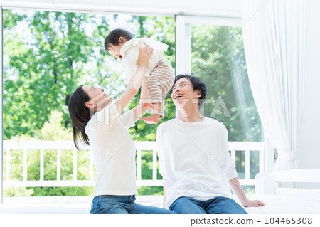 A smiling family of three (family, childcare, childcare, baby) 104465308