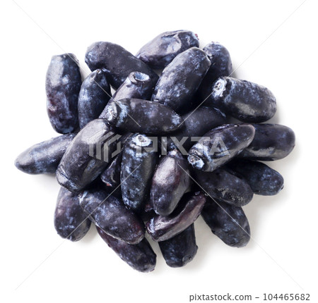 Heap of honeysuckle berries on a white background. Top view 104465682
