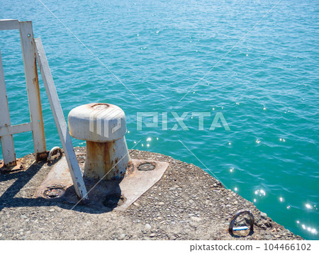 Bollards on the seashore. A place to stop ships.   The place where the ship is attached to the shore 104466102