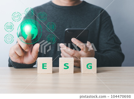 businessman use technology to reduce co2. the idea for environmentally conscious business, climate change, ecology, friendly environment investment, ESG for Environment Social and Governance 104470698