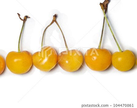 yellow cherry. Ingredient for jam. Multi-colored cherries with stems are beautifully laid out on a white background. Stem berry isolate. Several berries are on the table. Berry from the bush. yellow cherry. Ingredient for jam. Multi-colored cherries with stems are beautifully laid out on a white background. Stem berry isolate. Several berries are on the table. Berry from the bush. 104470861