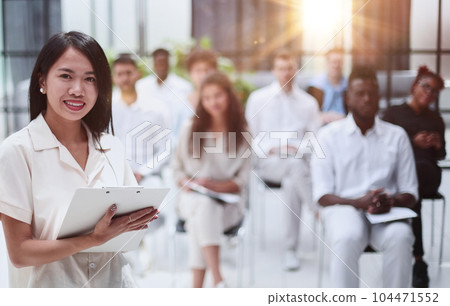Selective focus of lecturer talking to audience during seminar in conference room Selective focus of lecturer talking to audience during seminar in conference room 104471552